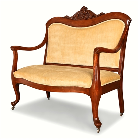 Victorian Eastlake Walnut Settee – Carved Crest & Velvet Upholstery