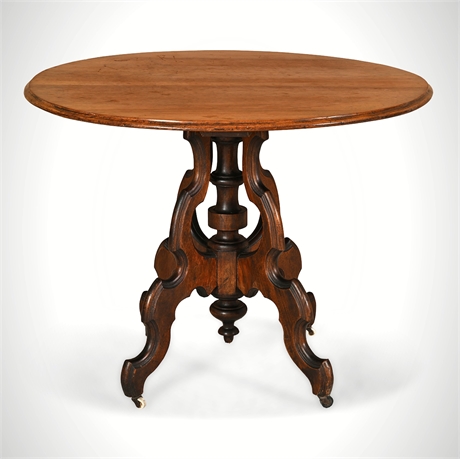 Victorian Walnut Oval Tilt-Top Parlor Table on Casters, Late 19th Century