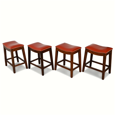 Charming Quartet of Red Faux Leather Saddle Bar Stools with Nailhead Detail