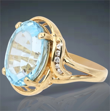 14K Gold Oval Blue Topaz & .1ctw Diamond Ring