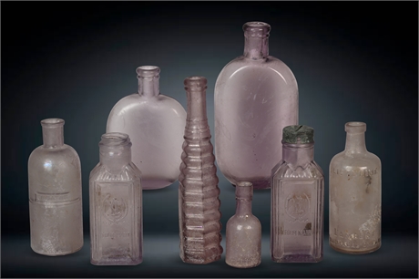 Antique Turned Purple Bottles