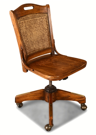 Vintage Oak Office Chair w/ Cane Back — Adjustable, Brass Casters