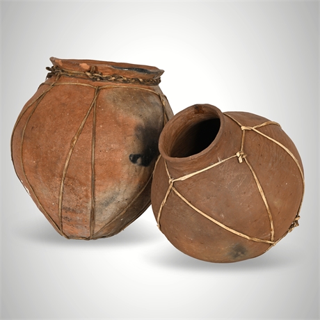 Pair of Tarahumara Terracotta Water Jars — Cowhide Bound, Hair-On