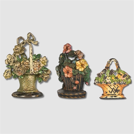 Trio of Early 20th Century Cast Iron Floral Basket Doorstops, Polychrome Paint