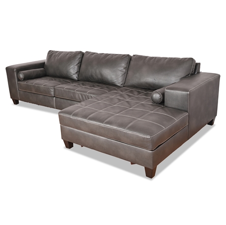 Nokomis Charcoal Faux Leather Sectional with Chaise by Ashley